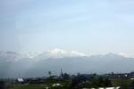 富山平野の車窓から見る雪の北アルプス