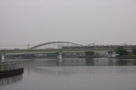 小田急線の多摩川橋梁と電車
