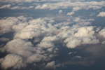 飛行機からみた雲間の桜島と噴煙